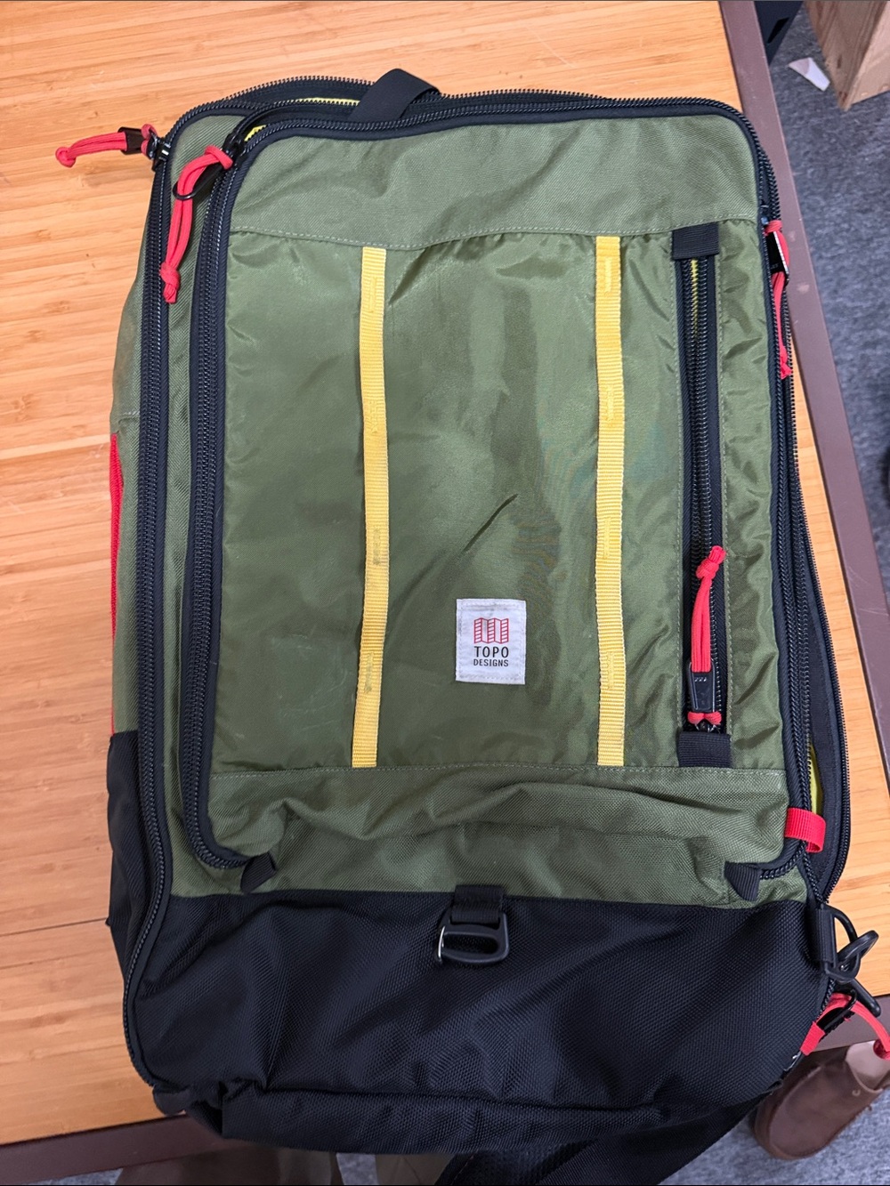 Topo Designs Olive Green Backpack with Yellow Accents and Red Pulls
